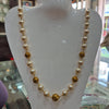 Pearl mala with gold balls