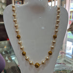 Pearl mala with gold balls
