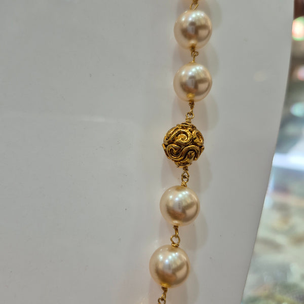Pearl mala with gold balls