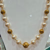 Pearl mala with gold balls
