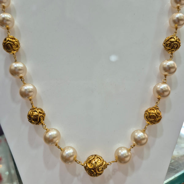 Pearl mala with gold balls